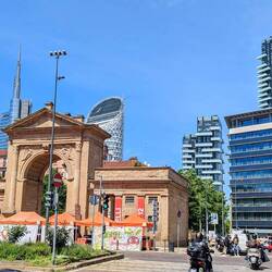 The Old City gates with a backdrop of modern skyscrapers.