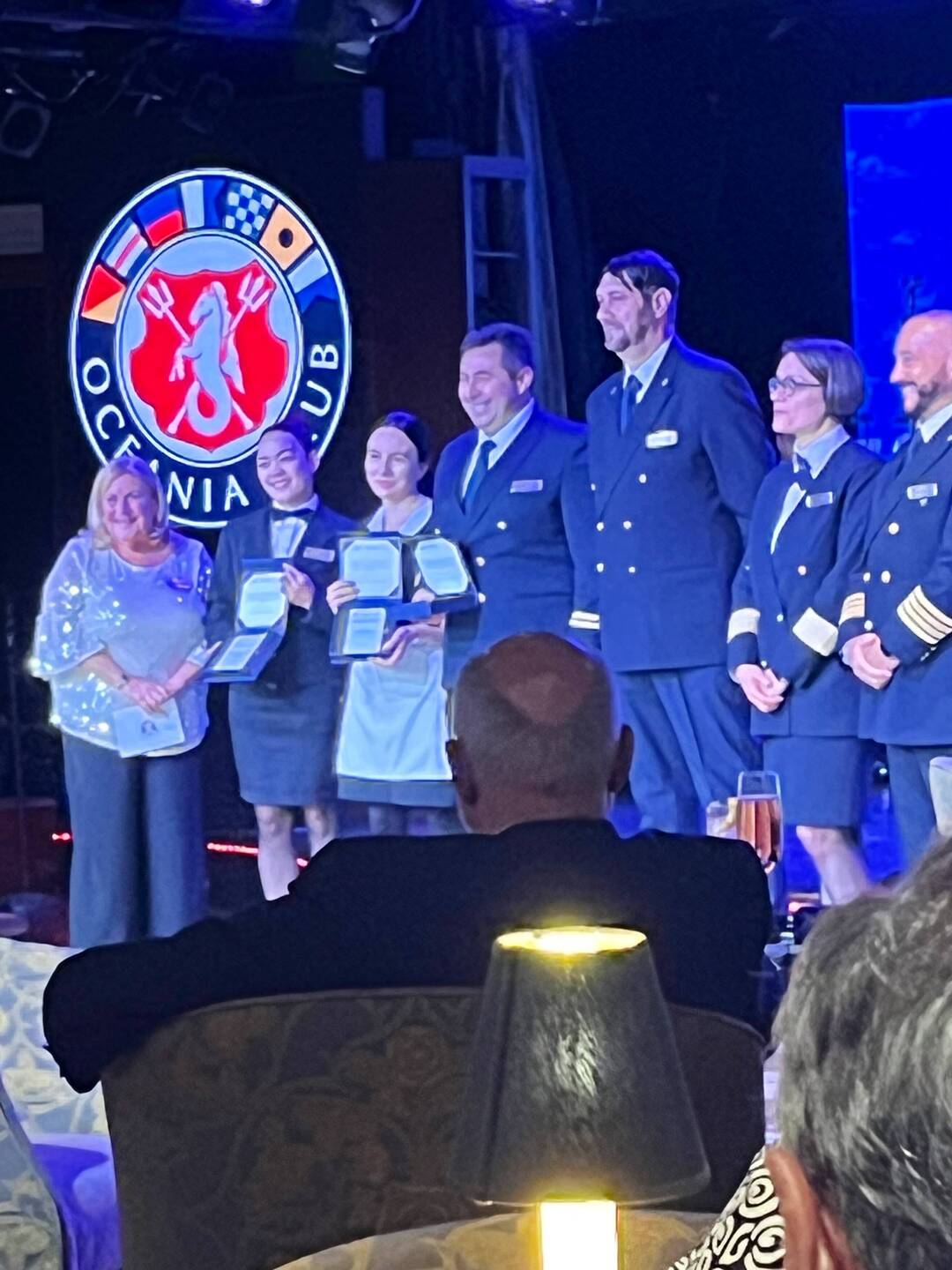Crew are presented with service awards at the party