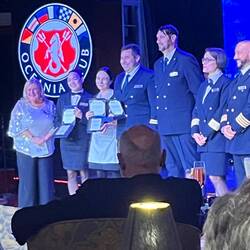Crew are presented with service awards at the party