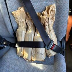 The precious cargo safely strapped in after a visit to the wine store!