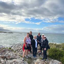 Team photo by the Atlantic Ocean in Hermanus