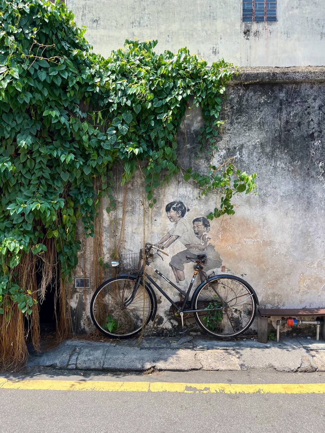 There's a unique charm to Ernest Zacharevic's murals