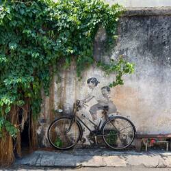 There's a unique charm to Ernest Zacharevic's murals