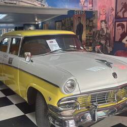 The sign says, "You can lie on the bonnet if you are female, under 40 and naked!"