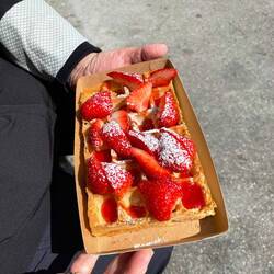Belgian waffle with fresh strawberies bought from a street vendor