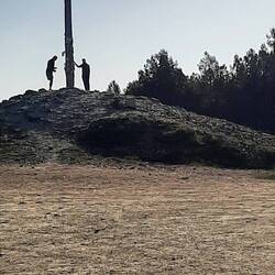 Cruz de Ferro with 2 pilgrims