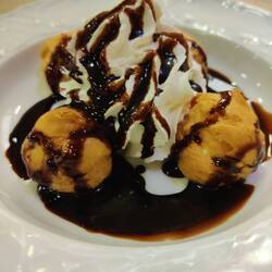 Profiteroles. Also known as profiteroles in Spain