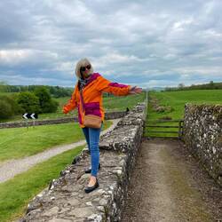 'Surfing' Hadrian's wall which extends well beyond the treeline in the distance