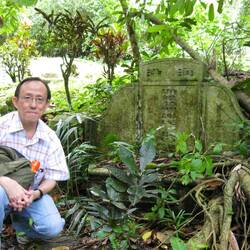 My cousin when he discovered our great grandmother's grave. Photo credit: H. Lim