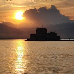 Beautiful sunset over Bourtzi Castle behind us