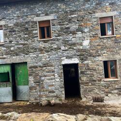 Zoom into the door to see cows. Barn below, home above