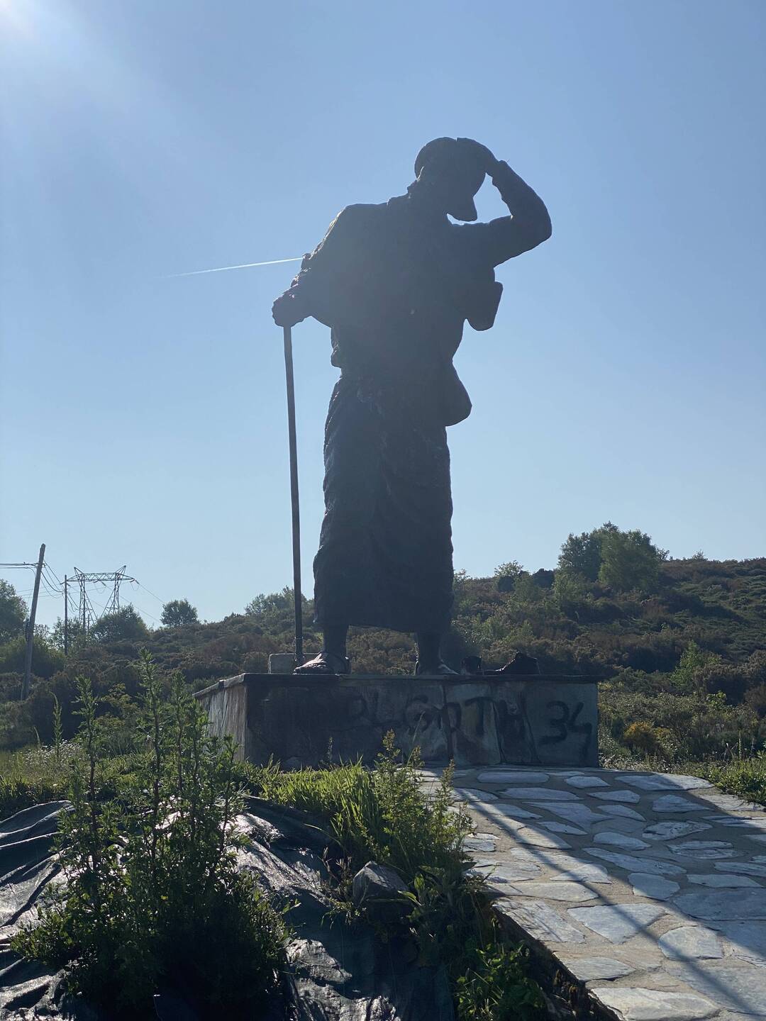 The third highest point of the Camino at 1208 meters. Notice the pilgrim is holding is hat! Wind!