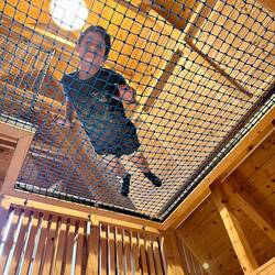 on the netting in the tree house loft