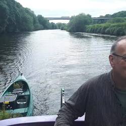 Contrast between the motorway bridge and the rural River Don lined with mature native woods.
