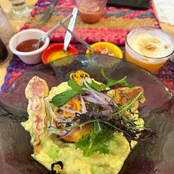 pepper stuffed with juicy meat on mashed potatoes with eggs and beans