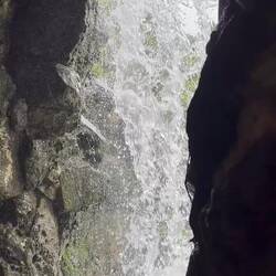 Walking behind a waterfall