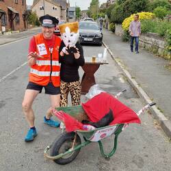 Pair of wheel barrow race competitors. Look at those legs, his not hers!