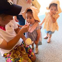 2-year-old twins enjoy an ice cream