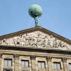 Atlas?? This city hall has a Greek influence