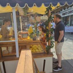 Buying traditional lemonade. They literally squeeze the lemons into the cup
