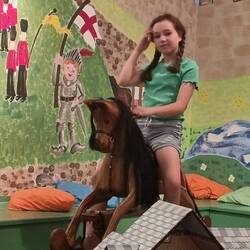 Riding a toy horse