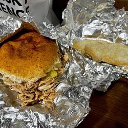 Pulled pork sandwich, apple game, and sage stuffing from Oink