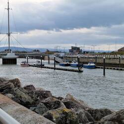 Entrance to Rhyl harbour with lifting Pont y Ddraig foot/cycle bridge