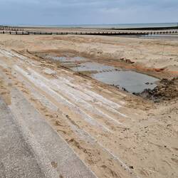 Holes dug ready for rocks for improved sea defences