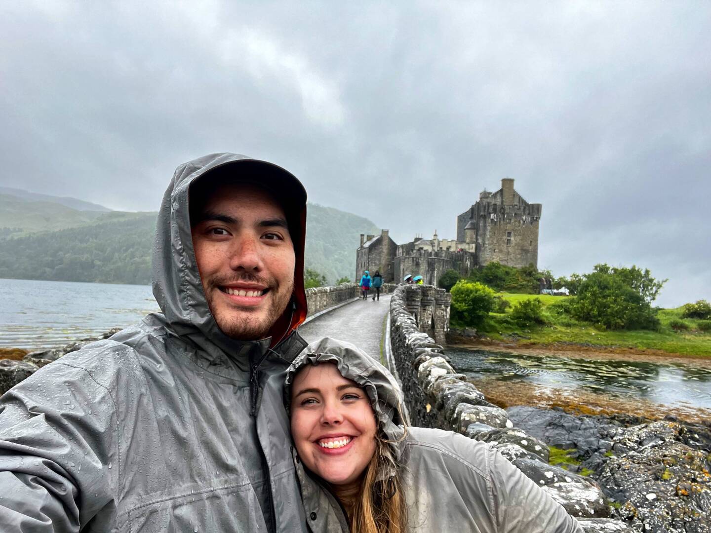 Still dryjng to stay dry in front of another castle