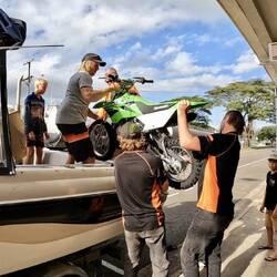 Loading in the bike into the boat