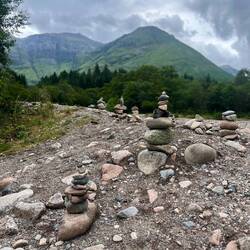 Hikers love to stack rocks near mountains