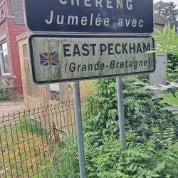 No wonder they hide this sign behind a bush