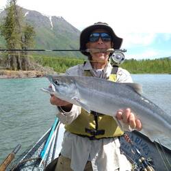 Dave lands a salmon in the boat. It is much easier from shore as they are fighters.