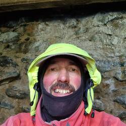 Me sat in Foel Grach shelter illustrating low ceiling
