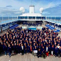 Traditional RTW photo on the pool deck — Aboard Insignia.