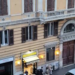 Very Italian view from our window - pizzeria and motorbikes.