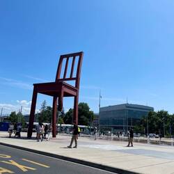 Big chair missing leg as a world symbol against land mines.