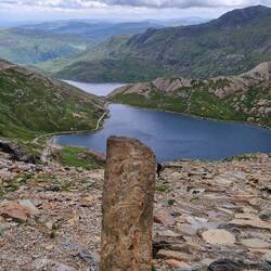 Stone marking junction of PYG and Miners tracks. Glaslyn behind and Llyn Llydaw beyond