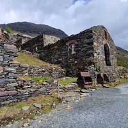 Disused slate mining building on shore of Llyn Llydaw lake