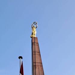 The golden statue that sits above the war memorial
