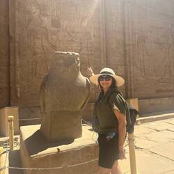 Granite statue of the falcon god Horus of Edfu stands in the court of Edfu Templ