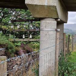 Trackside wires seem closer to footpath on underbridge than one might expect