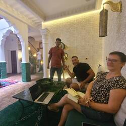 Riad staff Abdel & Kahim & owner Valerie in reception.