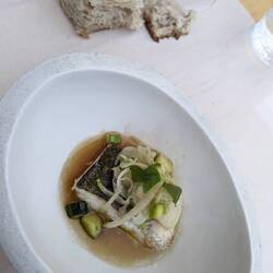 Pollack. Thai spices and fresh herbal elements.