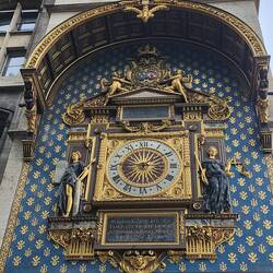 The Conciergerie clock on the facade of the Palais de Justice