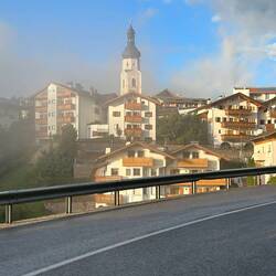 The late afternoon sun shines on Castelrotto