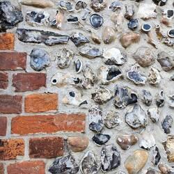 Flint stone masonry. Very common around here.