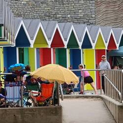 Enjoying their day at the seaside despite the weather