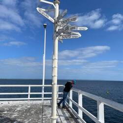 Directional signs at the end of the jetty