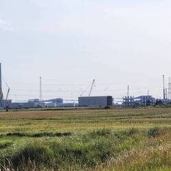 Wind turbine factory. Masts on left, blades stacked on right